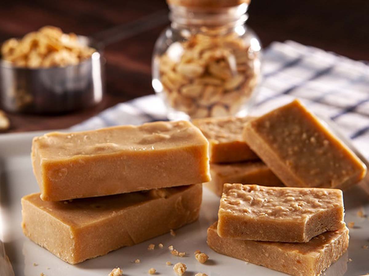 Thick blocks of smooth, sweet homemade caramel fudge neatly stacked.