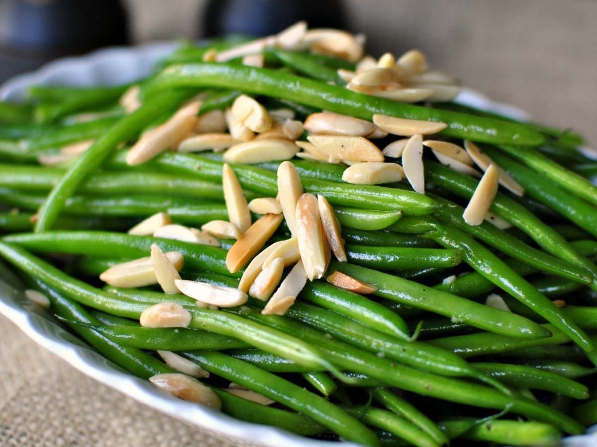 Fresh green beans blanched and tossed with toasted crunchy silvered almonds bits.
