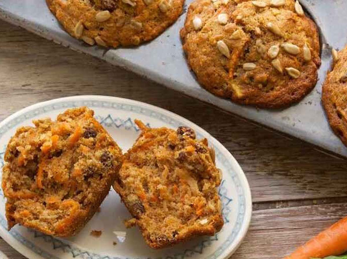 A basket of wholesome, rustic health muffins filled with whole grains and seeds.