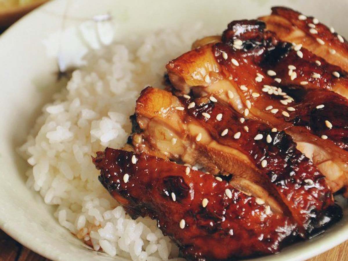 A thick, glossy dark brown homemade teriyaki glaze sauce in a bowl.