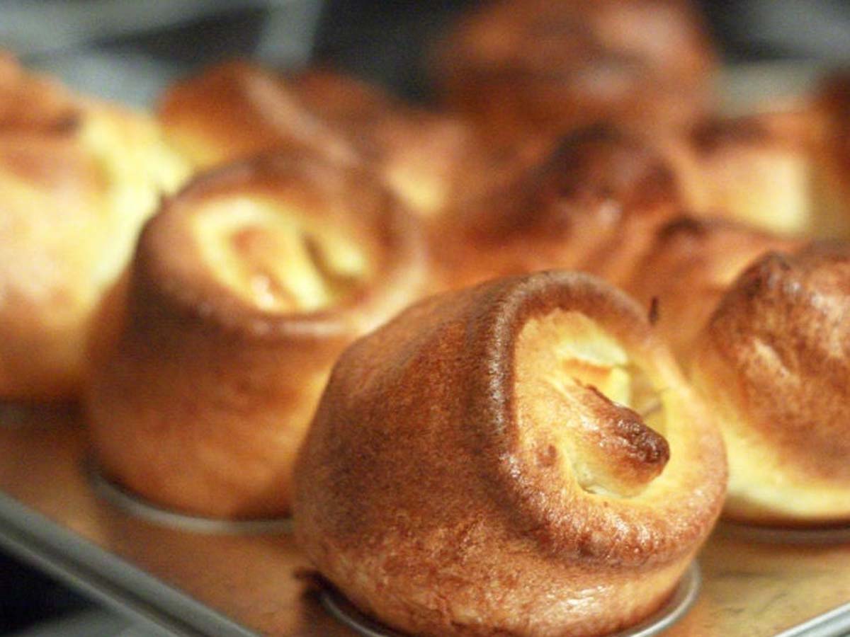 Puffy, hollow mini Yorkshire puddings baked to a perfect golden brown crisp.