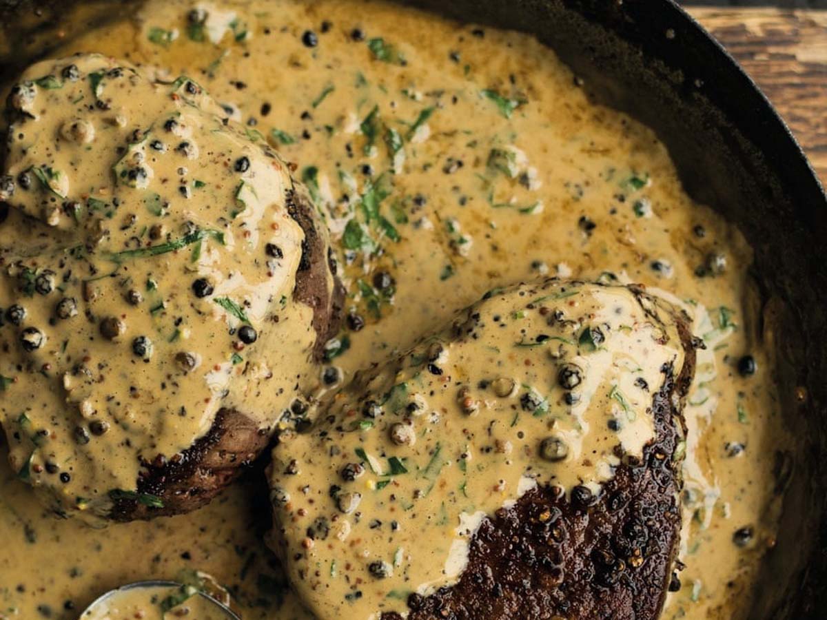 A pungent and bold creamy mustard and pepper steak sauce served warm.