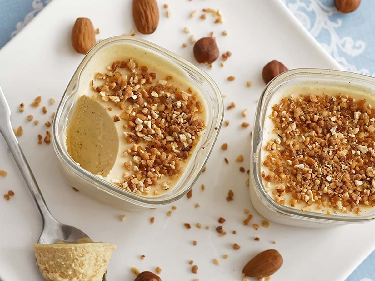 A sleek, elegant slice of cold parfait glace frozen dessert on a plate.