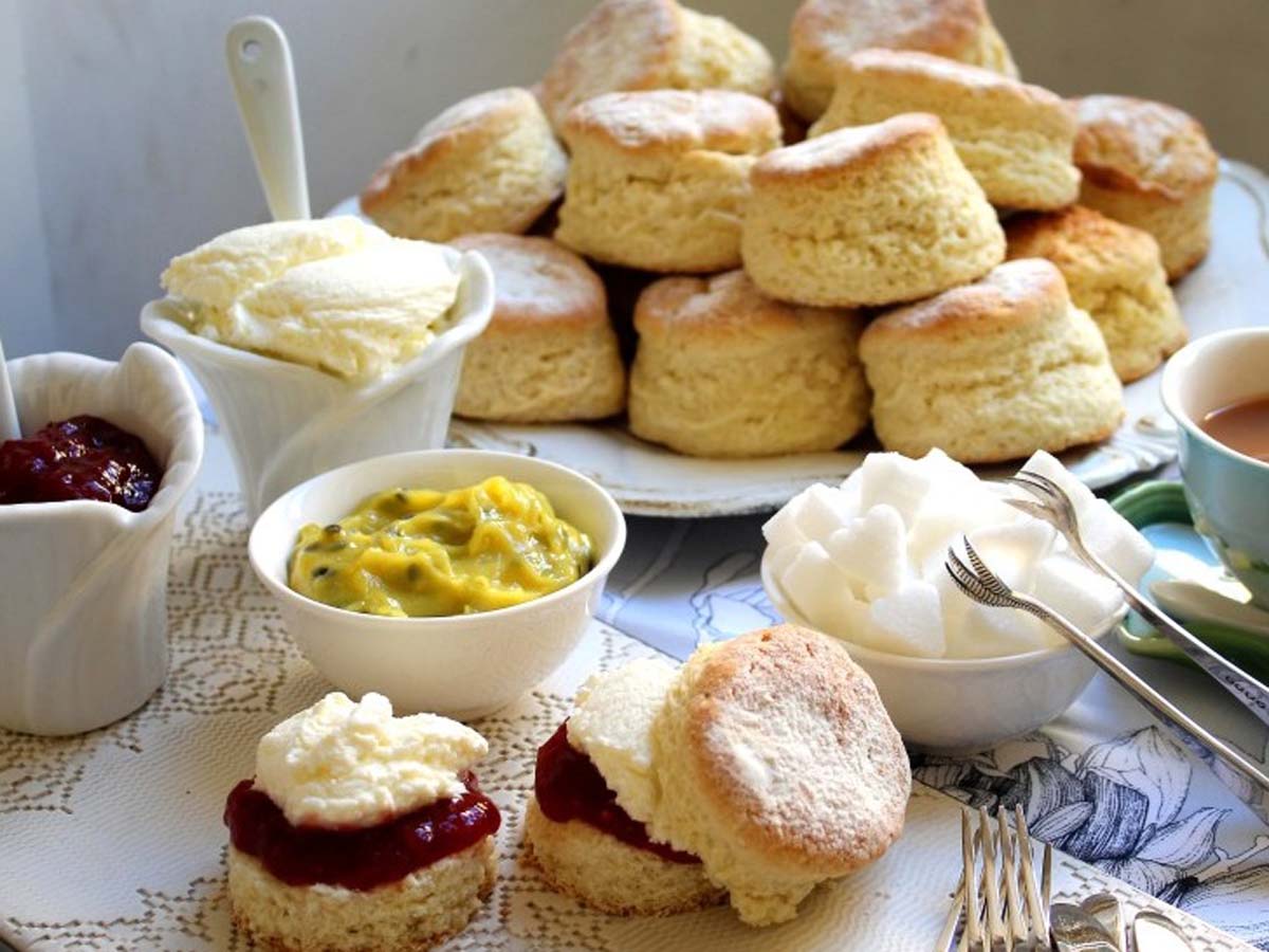 Golden brown, freshly baked buttermilk scones served with jam and dollops of cream.