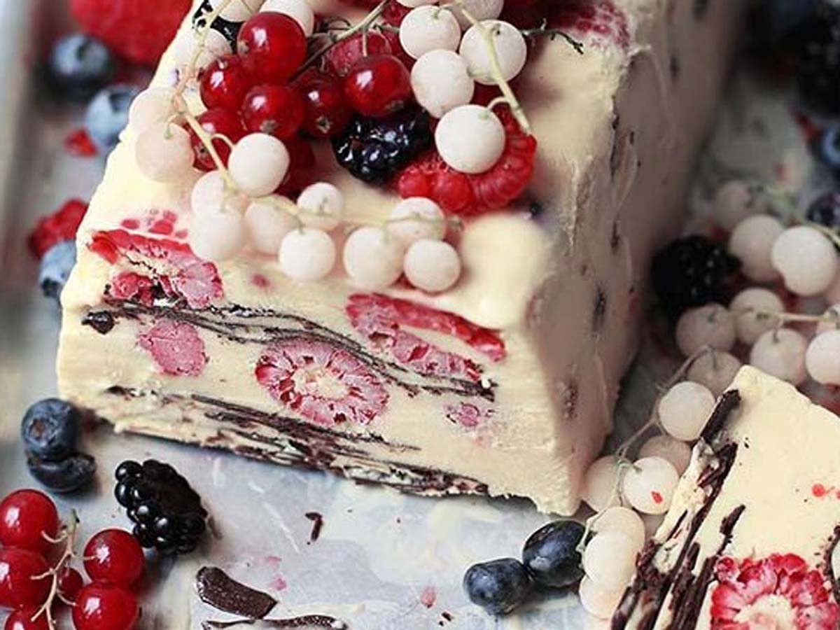 A smooth semi-freddo frozen chocolate dessert sliced cleanly to show its rich texture.