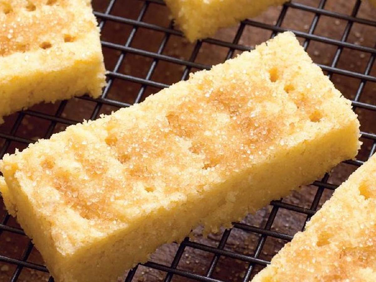Buttery, crumbly shortbread squares baked to a delicate golden colour and sliced into bars.