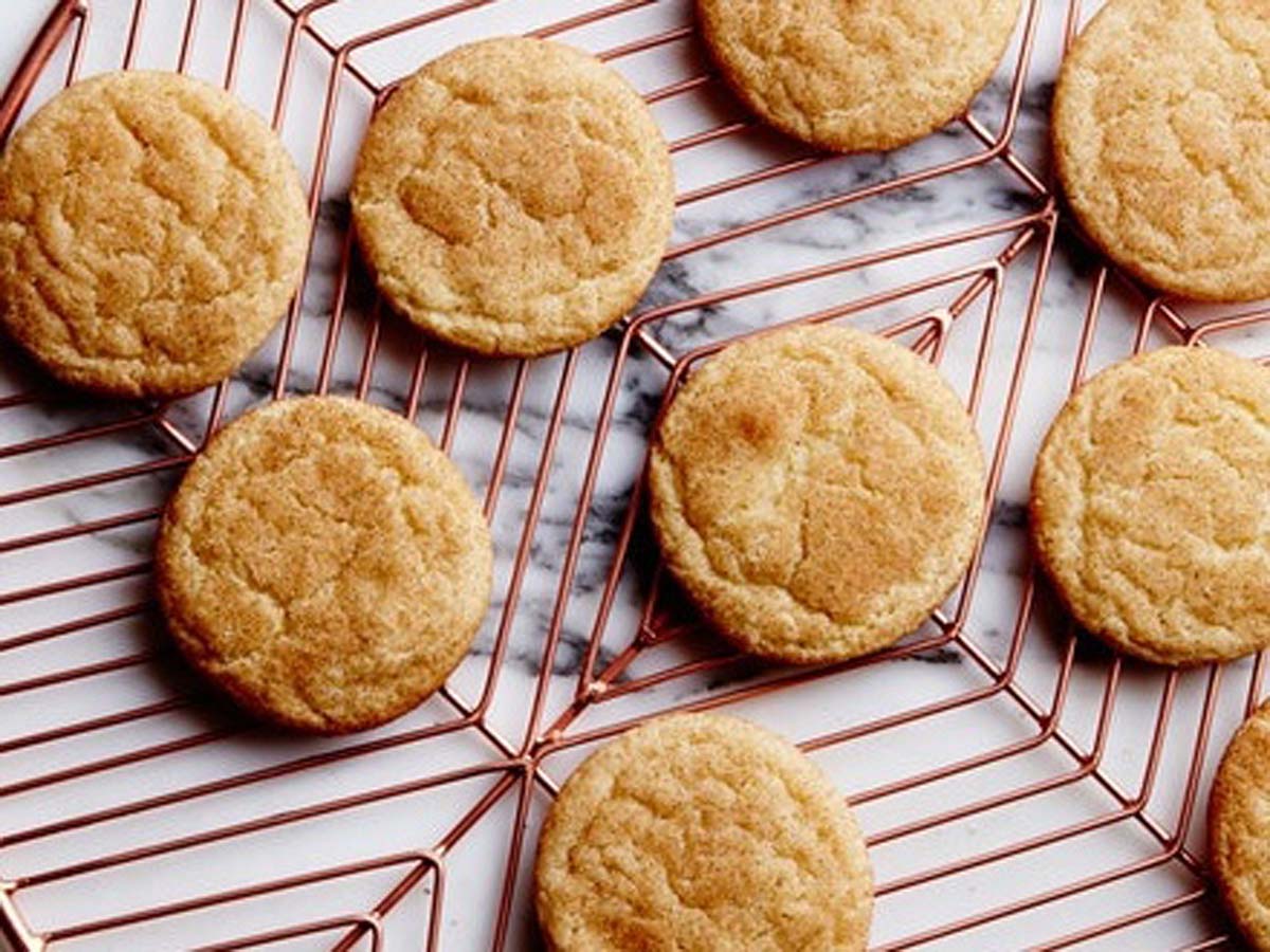 Crisp homemade snickerdoodle biscuits rolled beautifully in cinnamon sugar.