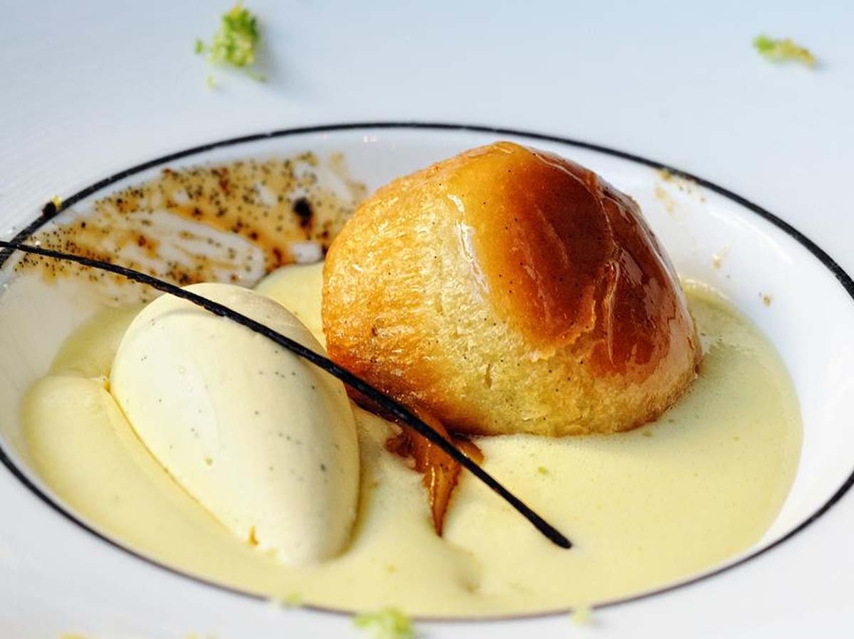 A frothy, whipped sweet Italian sabayon custard dessert served in a wine glass.
